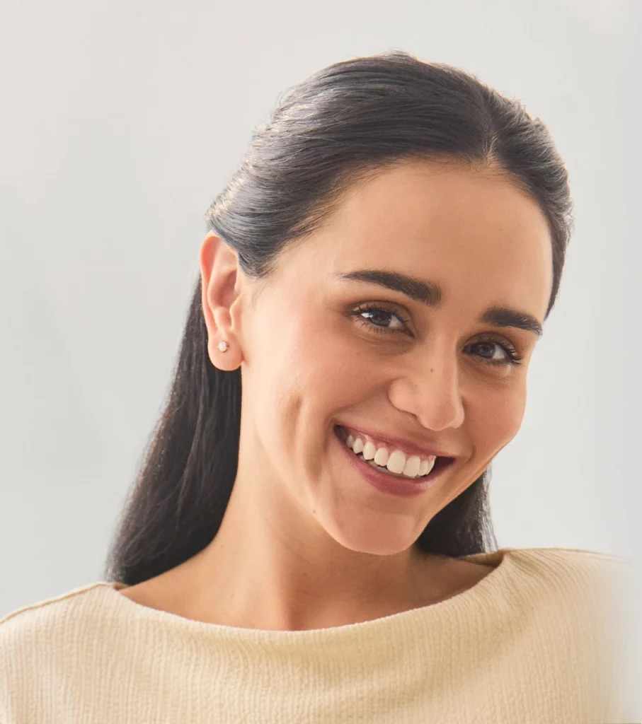 Dark-haired patient Priscilla, smiling