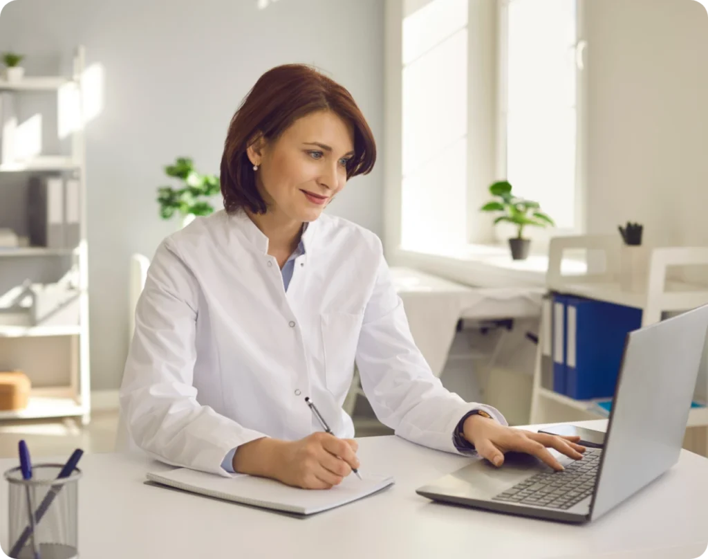 Doctor looking at her computer