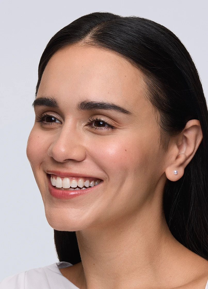 Patient Priscilla smiling with no lines outside her eyes.